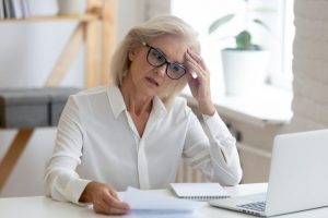 concerned woman looking at online legal site